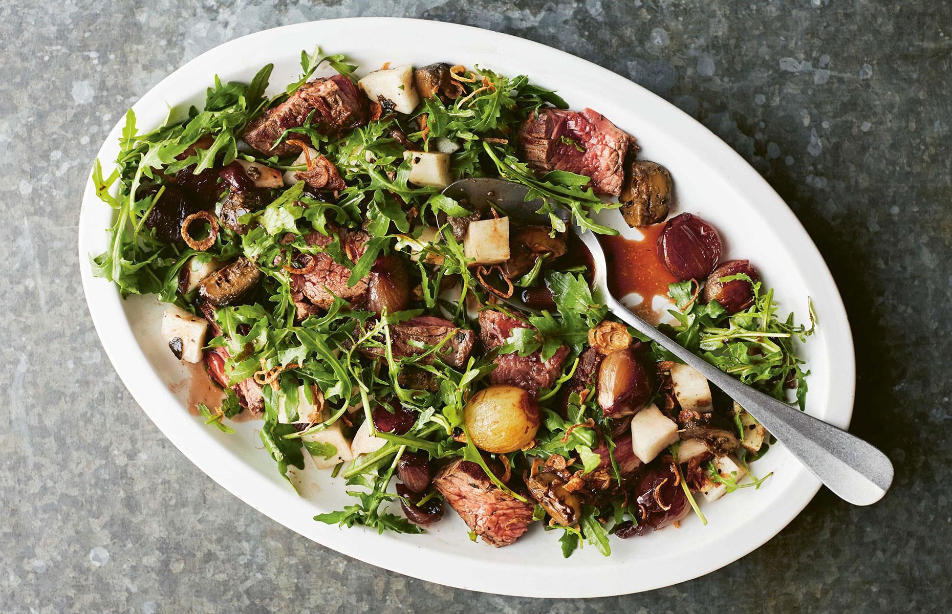 Steak salad with pickled walnut-braised shallots