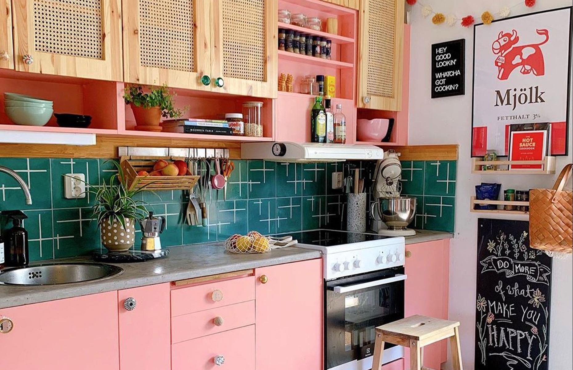 Boho pink kitchen with rattan units