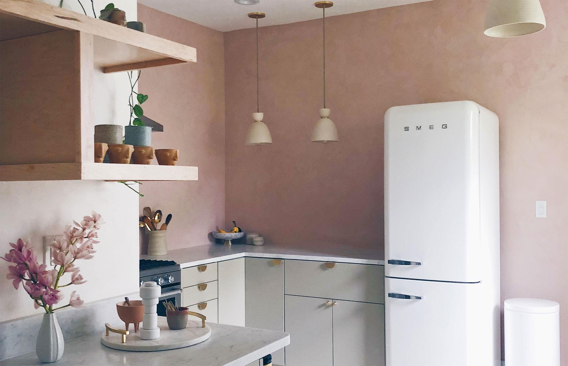 Luxurious pared-back pink kitchen