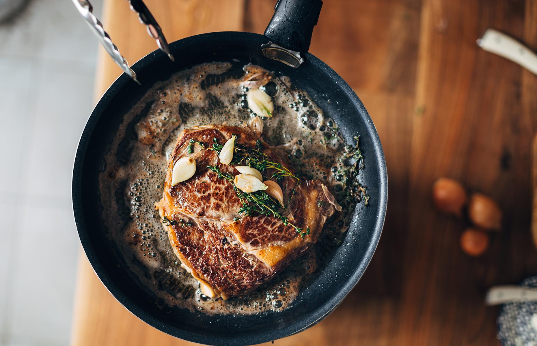 Cooking piece. Steak in a Pan. Pan with foods.