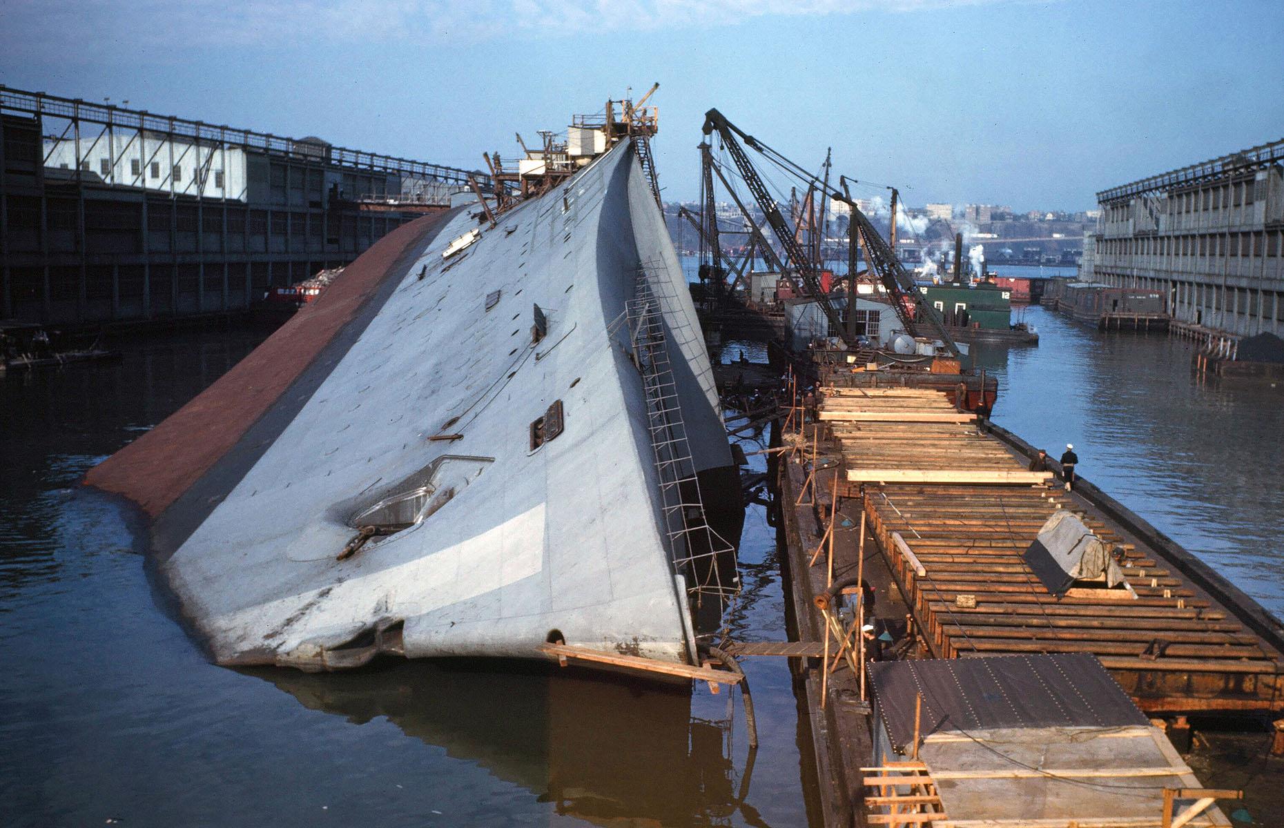 February 1942: The SS Normandie lists at New York Pier, New York, USA