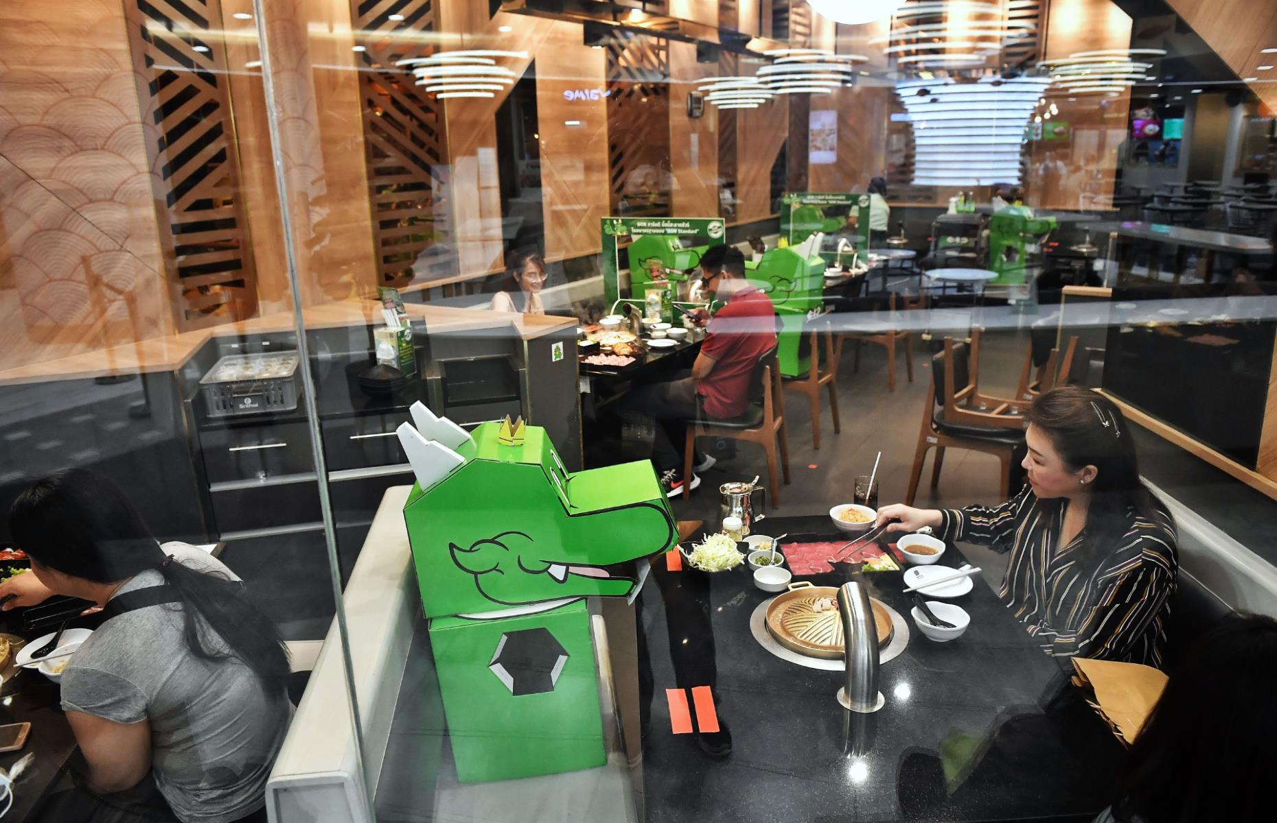 Bangkok, Thailand: Cardboard dinosaurs join restaurant guests