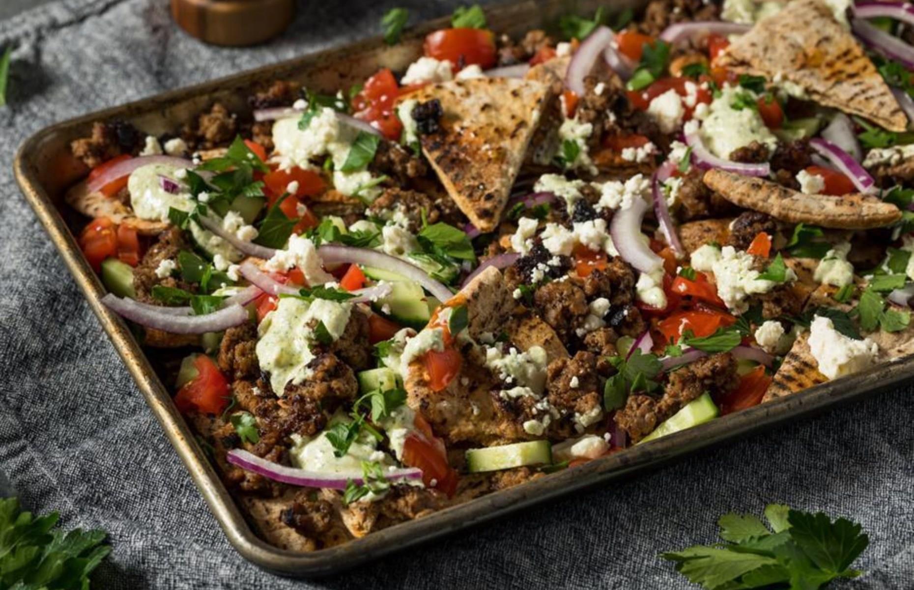 Homemade pitta nachos with crispy lamb and salad 
