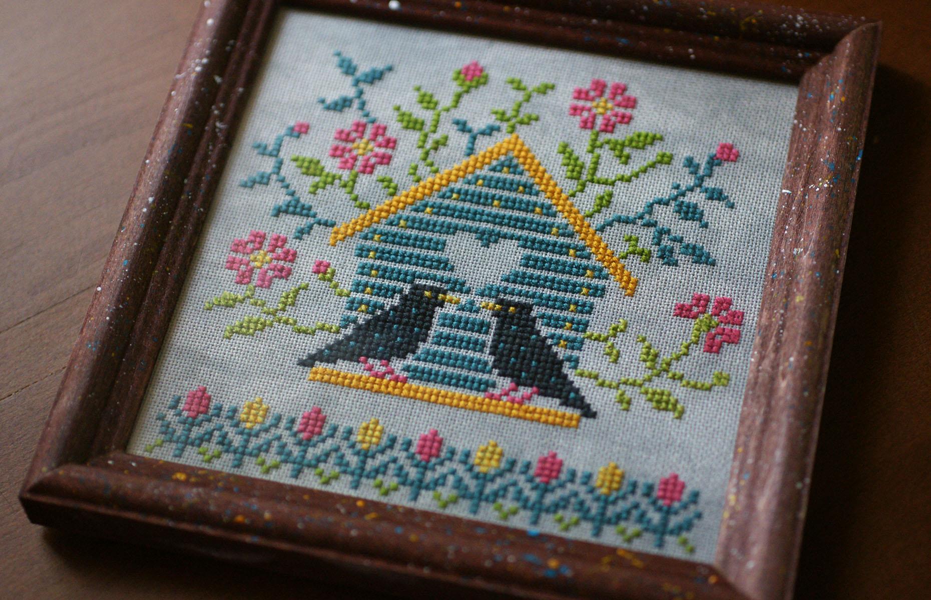 Framed cross-stitch designs