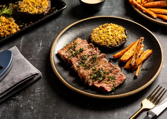 Sirloin steak with pink peppercorn sauce and herb-crusted Portobello mushroom recipe