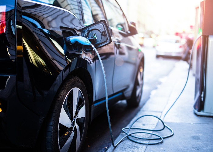 Picture of an EV charging - which cars have the best range?  (Image: Shutterstock)