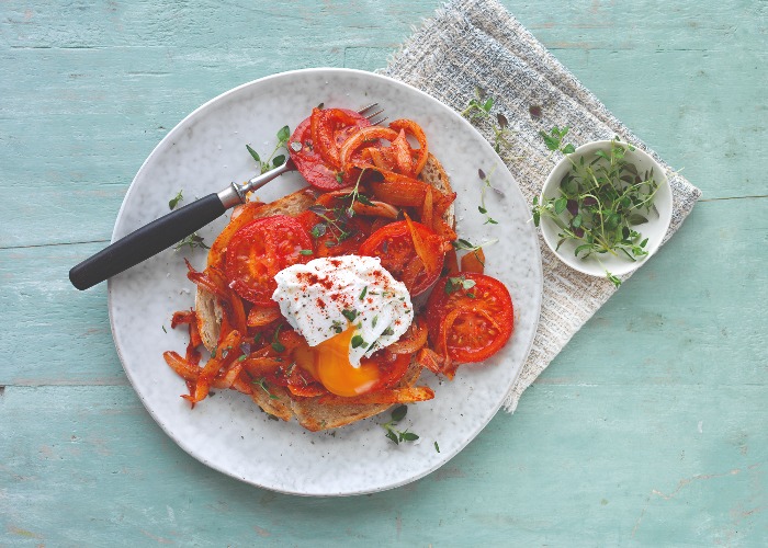 British tomato toast with poached egg and parsley