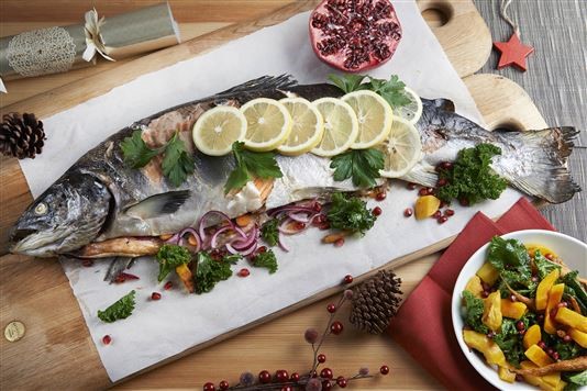 Whole baked salmon with kale, squash and pomegranate salad recipe