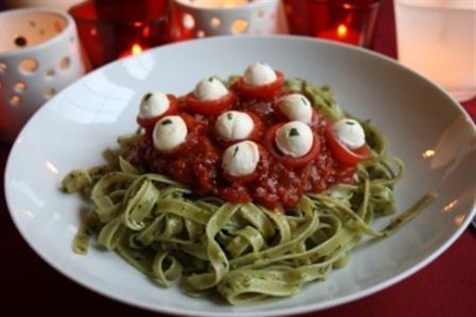 Green slime eyeball pasta with fiery hell sauce recipe
