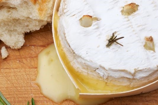 Whole camembert baked with garlic and rosemary recipe